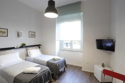 Letto o letti in una camera di Tammurriata Nera Bedroom