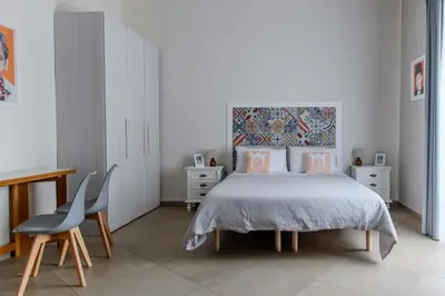 Letto o letti in una camera di Tinellari Rooms