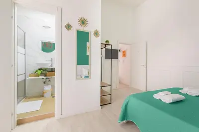 Letto o letti in una camera di Salotto Napoletano Minù