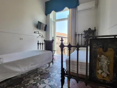 Letto o letti in una camera di ART HOUSE VENUSIO Naples