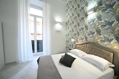 Letto o letti in una camera di LudBen Dante B&B