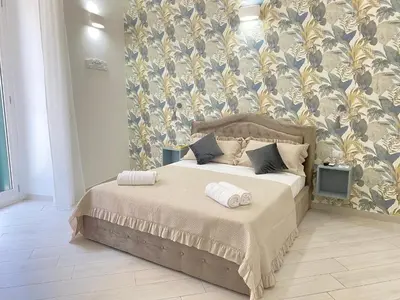Letto o letti in una camera di LudBen Dante B&B