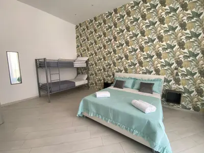 Letto o letti in una camera di LudBen Dante B&B