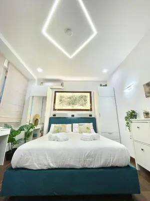 Letto o letti in una camera di Re Ferdinando Suite Mergellina