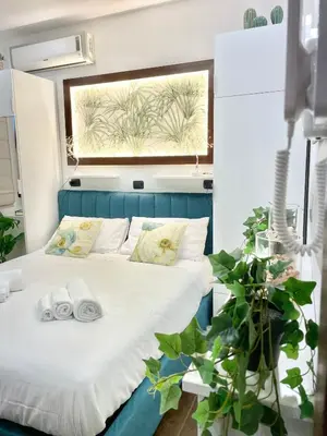 Letto o letti in una camera di Re Ferdinando Suite Mergellina