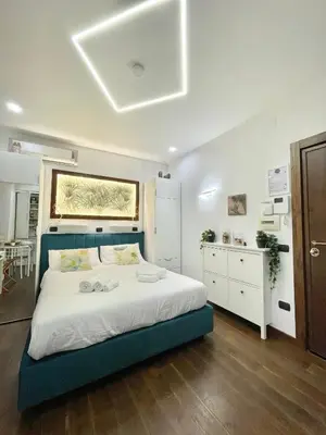 Letto o letti in una camera di Re Ferdinando Suite Mergellina