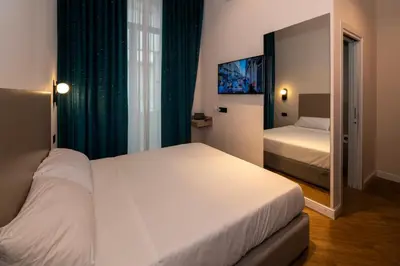 Letto o letti in una camera di Maison Toledo Suites