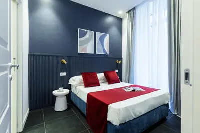 Letto o letti in una camera di Epoca Suites Napoli