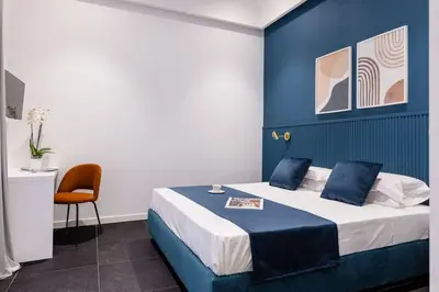 Letto o letti in una camera di Epoca Suites Napoli