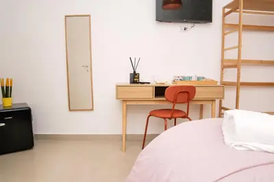 Letto o letti in una camera di Domus Carmela