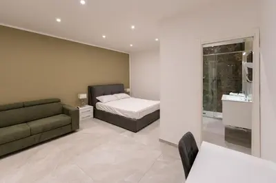 Letto o letti in una camera di Suites Gaudioso Napoli center