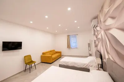 Letto o letti in una camera di Suites Gaudioso Napoli center
