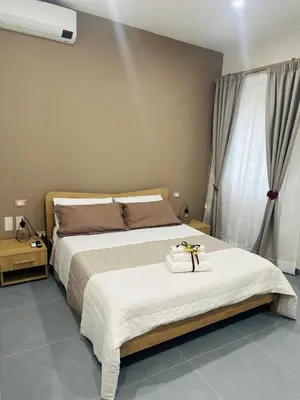 Letto o letti in una camera di Le radici di Parthenope