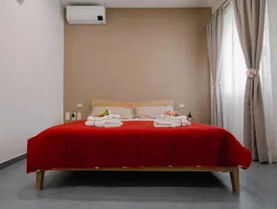 Letto o letti in una camera di Le radici di Parthenope