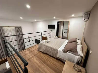 Letto o letti in una camera di Le radici di Parthenope