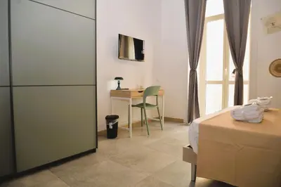 Letto o letti in una camera di Vinyls' Green Home - Toledo Centro Storico