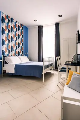 Letto o letti in una camera di Neapolis Guest House