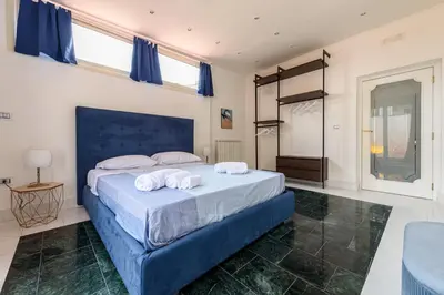 Letto o letti in una camera di Amazing and central penthouse with terraces in the heart of Napoli