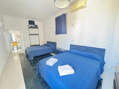 Letto o letti in una camera di Amazing and central penthouse with terraces in the heart of Napoli