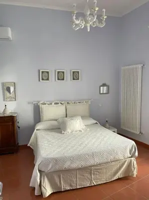 Letto o letti in una camera di Casa da “Nonna Iolanda” Napoli centro storico