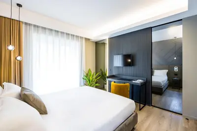 Letto o letti in una camera di MH SUITES Plebiscito
