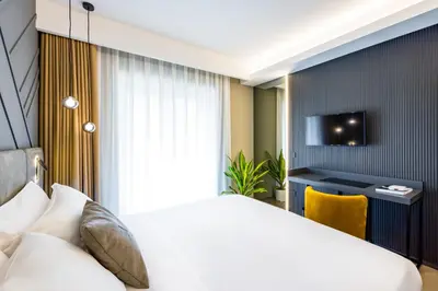 Letto o letti in una camera di MH SUITES Plebiscito
