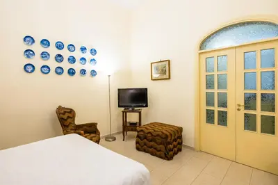 TV o dispositivi per l'intrattenimento presso Homely City Apartment by Wonderful Italy