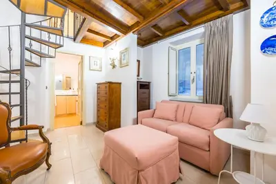 Area soggiorno di Homely City Apartment by Wonderful Italy