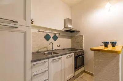 Cucina o angolo cottura di Napoli Relax Rooms Chiaia - Mergellina - Posillipo
