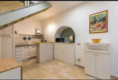 Cucina o angolo cottura di Napoli Relax Rooms Chiaia - Mergellina - Posillipo