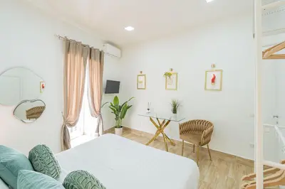 Letto o letti in una camera di Random Holidays Napoli By Dimorra