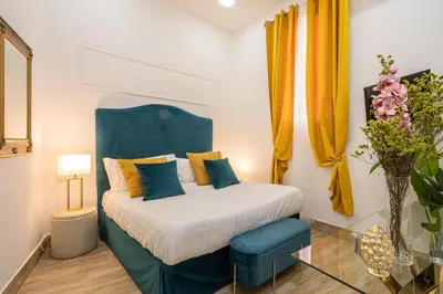 Letto o letti in una camera di Random Holidays Napoli By Dimorra