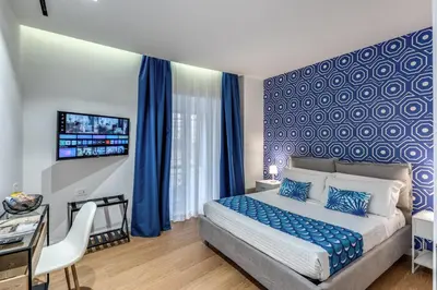 Letto o letti in una camera di Nibla's Room Napoli