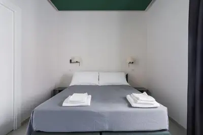 Letto o letti in una camera di Weaver Suites By Dimorra