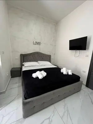 Letto o letti in una camera di Terrazza luxury Valentino