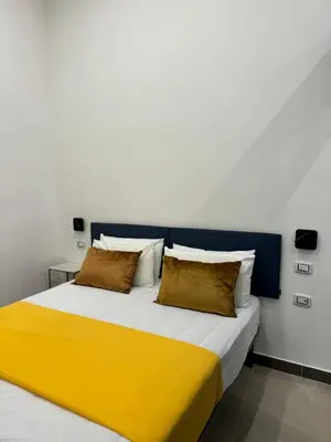 Letto o letti in una camera di Art Suite San Liborio