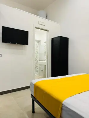 Letto o letti in una camera di Art Suite San Liborio