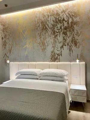 Letto o letti in una camera di Le Dimore di Lorenzo