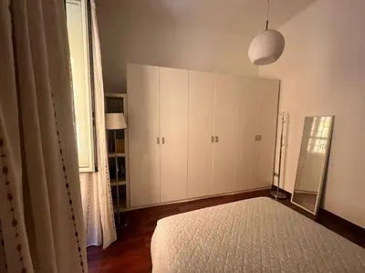 Letto o letti in una camera di Casetta Centrale di Bibi a Piazza Amedeo