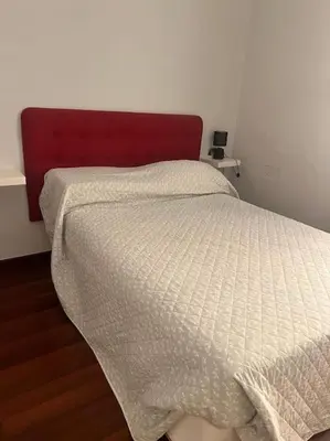 Letto o letti in una camera di Casetta Centrale di Bibi a Piazza Amedeo