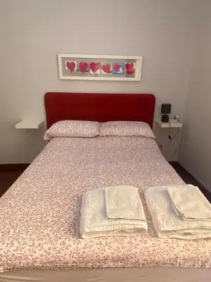 Letto o letti in una camera di Casetta Centrale di Bibi a Piazza Amedeo