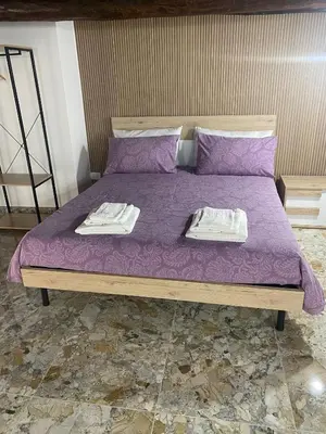 Letto o letti in una camera di Dora House Napoli