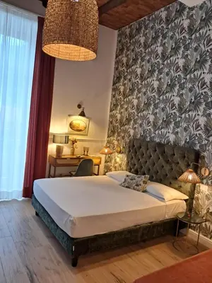Letto o letti in una camera di Domus Sirena