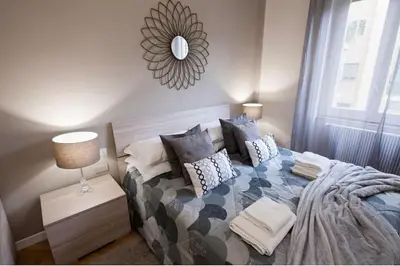 Letto o letti in una camera di Vomero Grandi Residenze Napoli