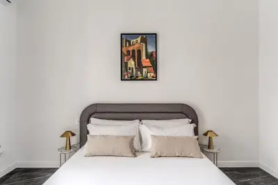 Letto o letti in una camera di Palazzetto Santa Lucia