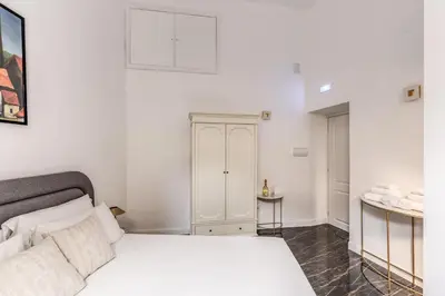 Letto o letti in una camera di Palazzetto Santa Lucia