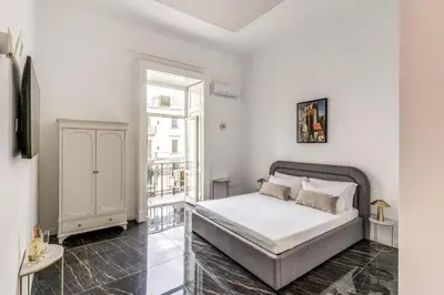 Letto o letti in una camera di Palazzetto Santa Lucia