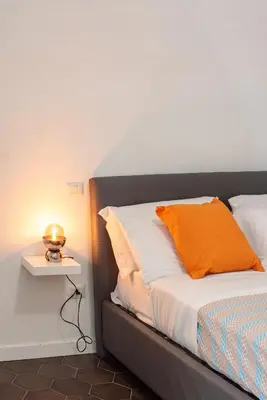 Letto o letti in una camera di Three brother's Home Augusteo
