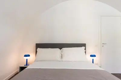 Letto o letti in una camera di Three brother's Home Augusteo