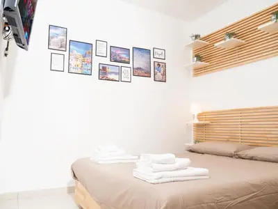 Letto o letti in una camera di Pizzofalcone Home - Napoli a 5 min da P Plebiscito